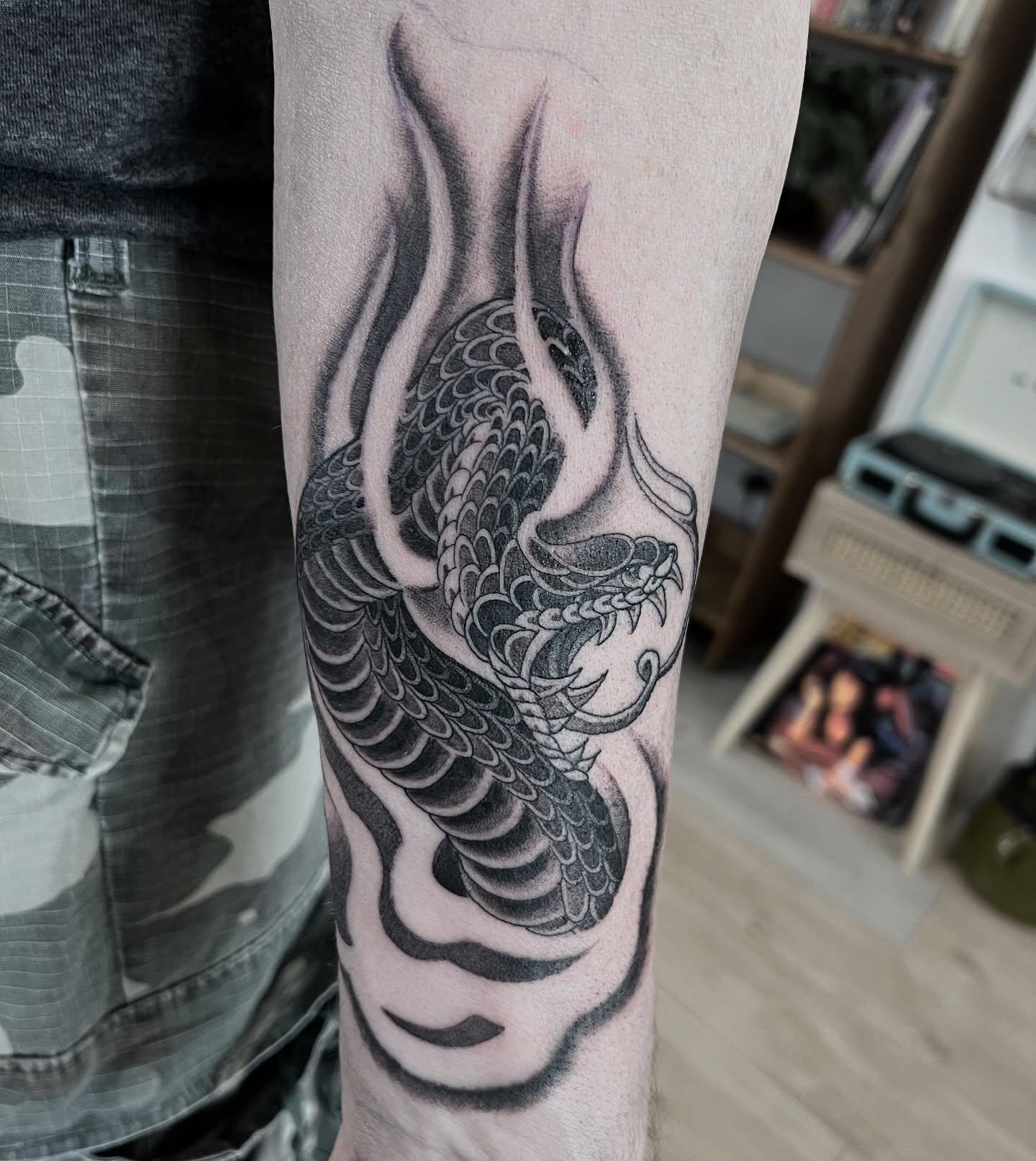 Fun Japanese style snake tattoo. Made by @joshwilding done in a 3rl and @dynamiccolor ink. This is an example of solid fine line tattooing that will stand the test of time. DM for enquires on something similar. #japanese #japanesetattoo #blackandgreytattoo #snaketattoo