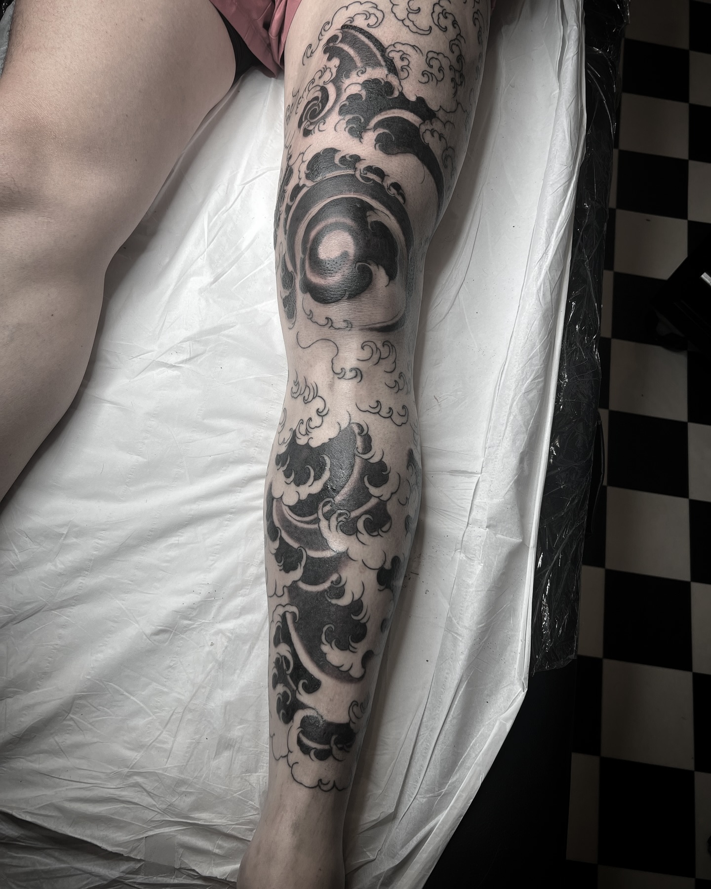 Thanks Billy for this project. It’s one session away from completion. 3 sessions in total. All drawn on freehand. Really enjoyed using the waves and leg shape to create one large flowing piece, I’ve aimed to show the more chaotic side to the ocean in this piece whilst sticking to a traditional Japanese style. #japanese #japanesetattoo #waves #wavestattoo #ocean #oceantattoo #oceanside #blackandgreytattoo #freehand #freehandtattoo #sleeve #leg #legsleevetattoo #tattooinspiration 
@boardwithbiscuits